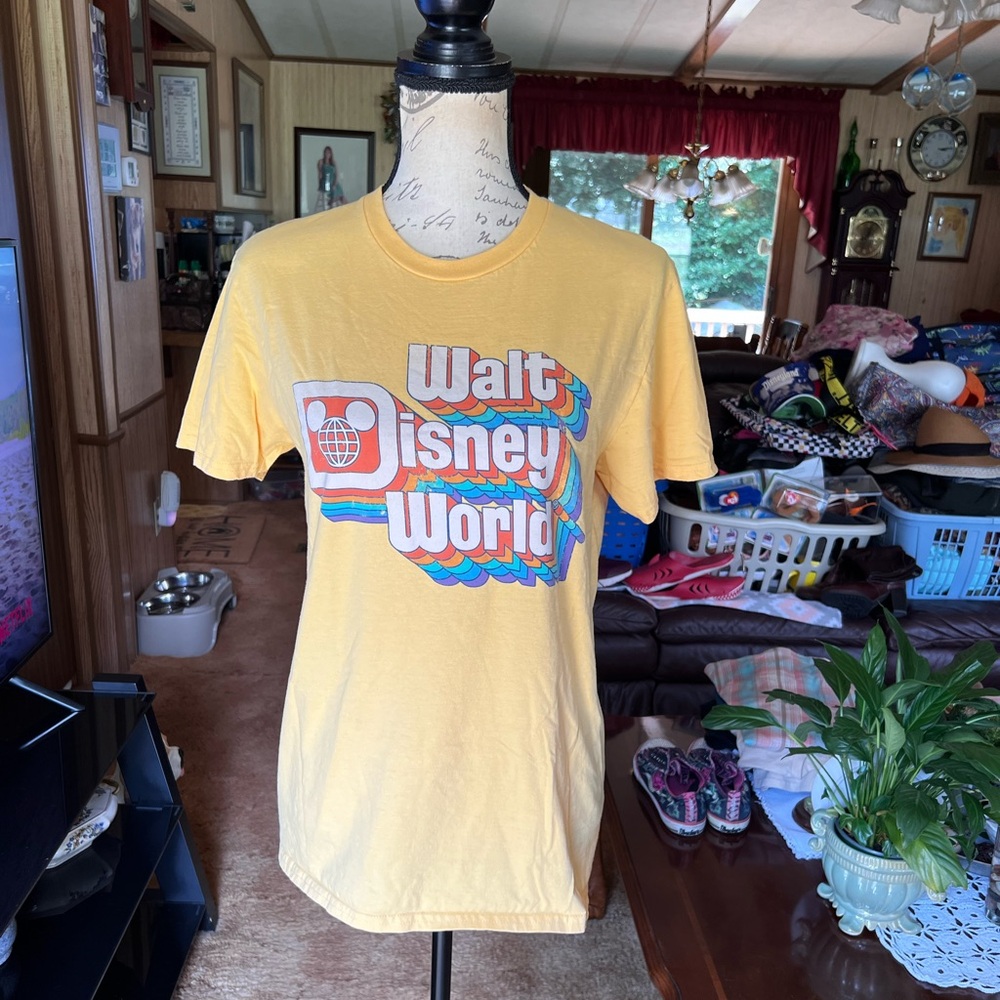 Women’s yellow Walt Disney World short sleeve tee shirt.